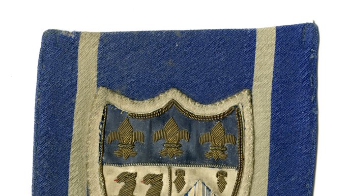 Embroidered crest pocket detail from Homerton jacket, c. 1940.