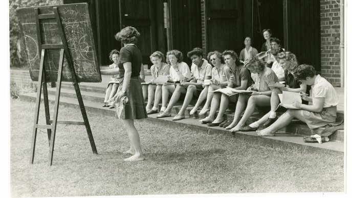Outdoor Physical Education class on the steps of the gymnasium, 1944.