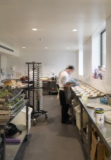 Catering staff member working in the new kitchen