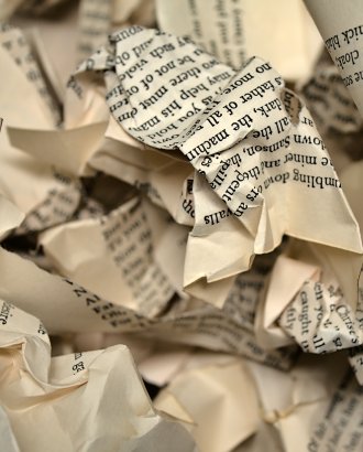 crumpled pages from a book